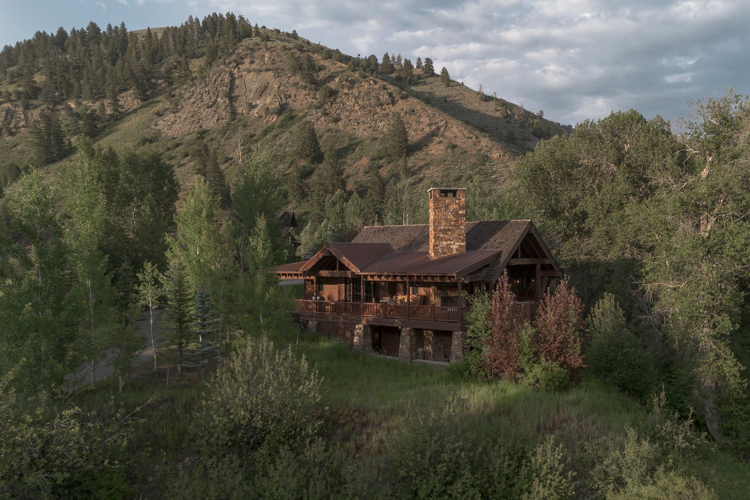 View of natural landscape surrounding the luxury Martin Creek Cottage part of the Private Residence Collection at Snake River Sporting Club in WY.