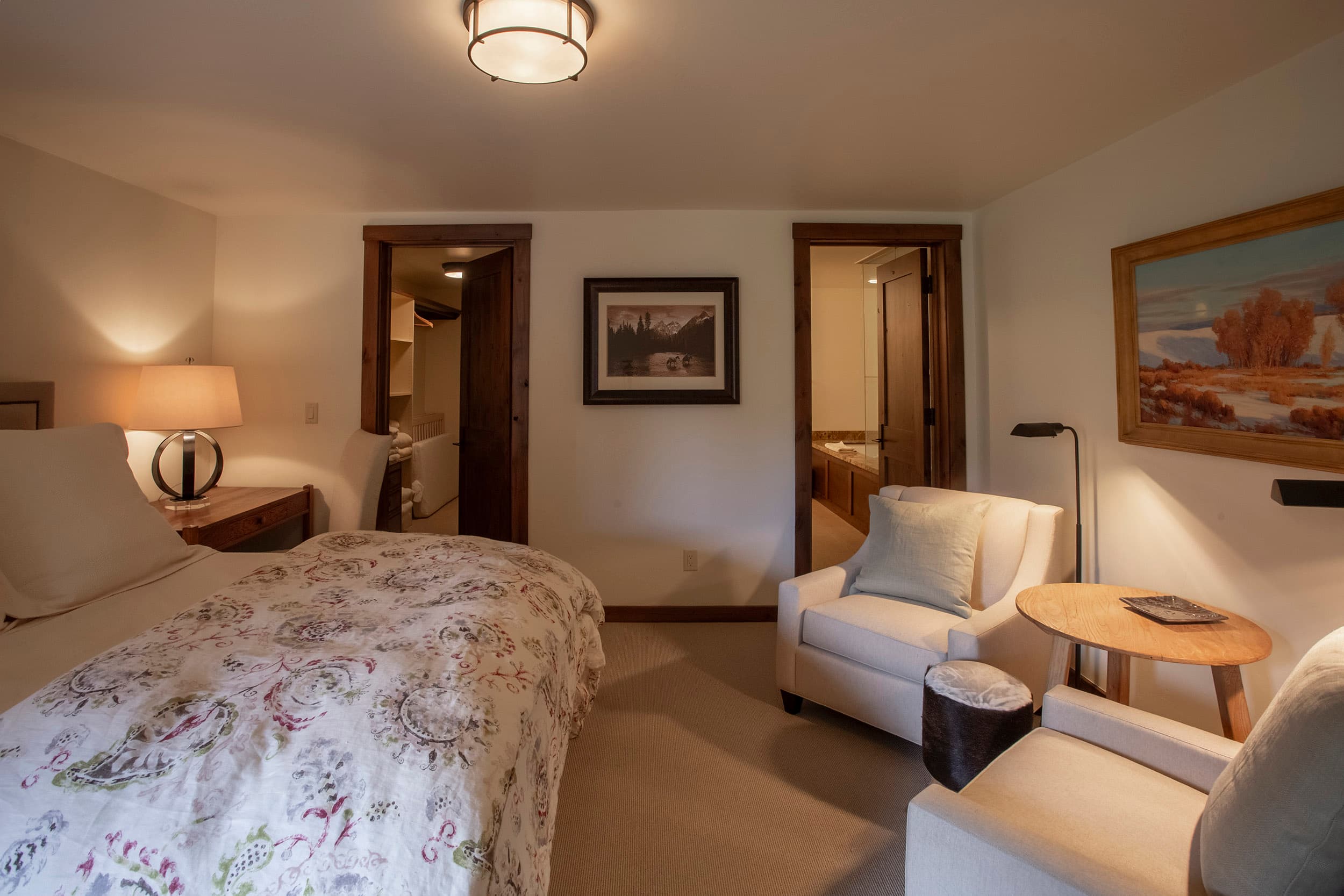 King bedroom with seating area in Martin Creek Cottage part of the Private Residence Collection at Snake River Sporting Club in WY.