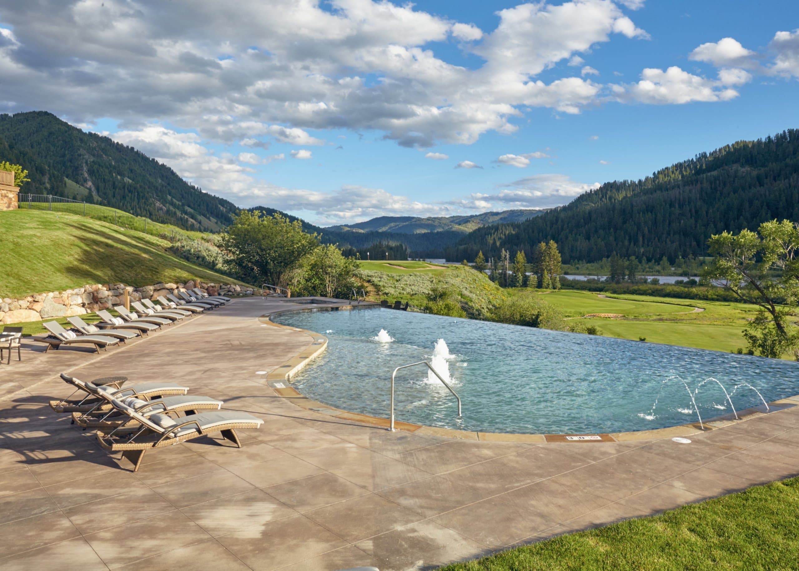 outdoor pool area overlooking mountain view at Snake River Sporting Club in Wyoming