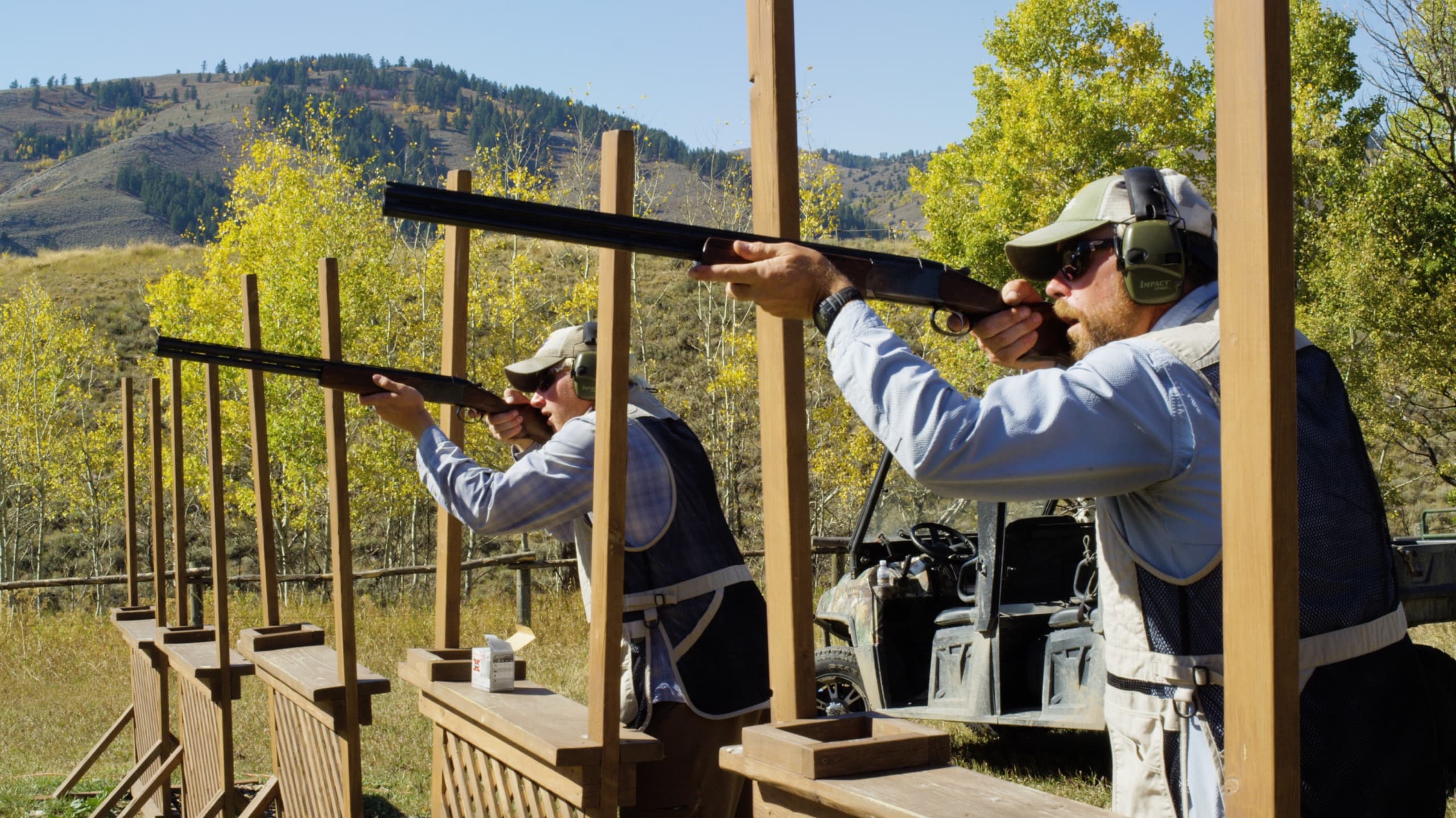 Two men skeet shooting