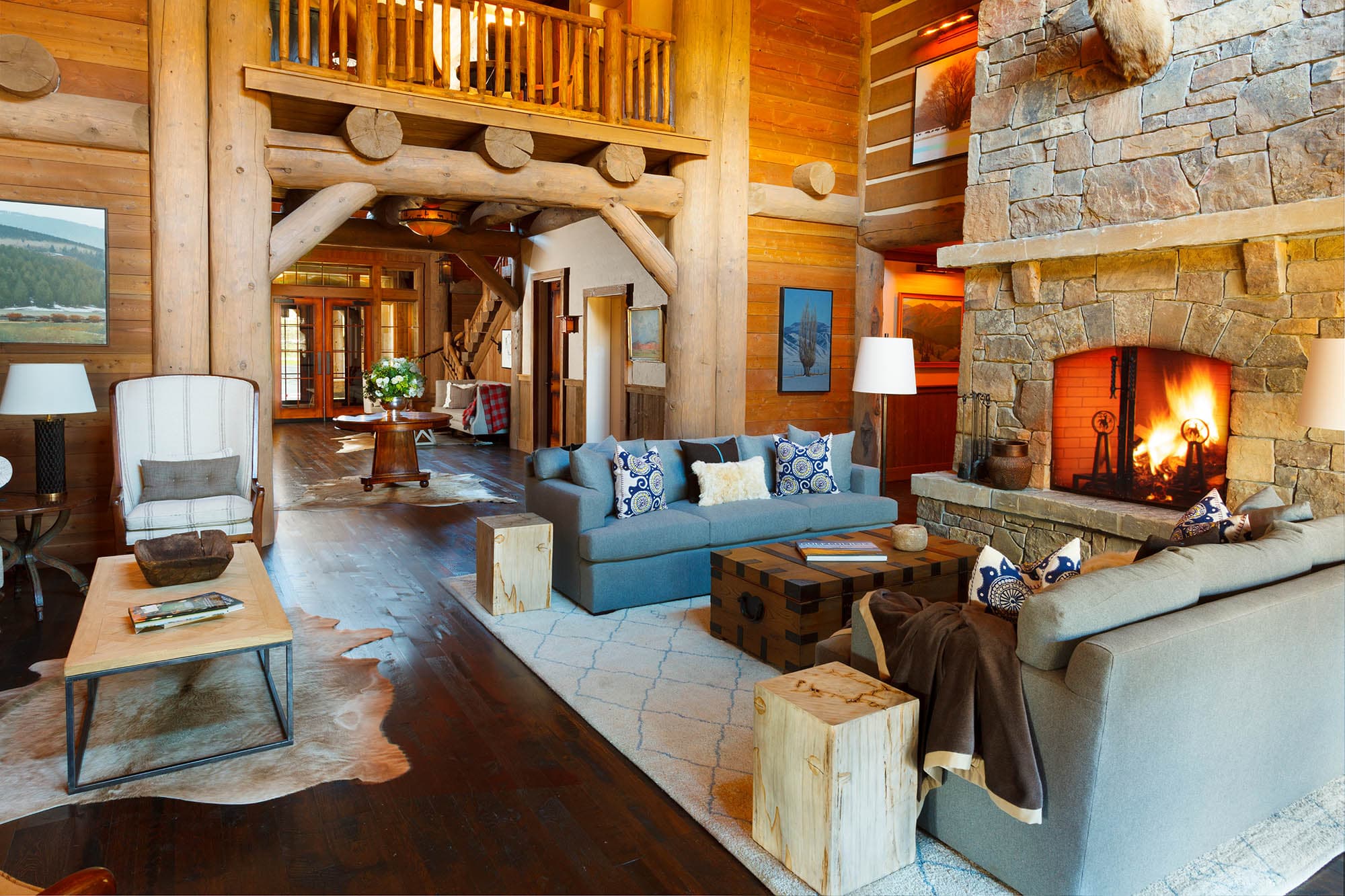 The living room interior with stone fireplace at the Snake River Sporting Club clubhouse