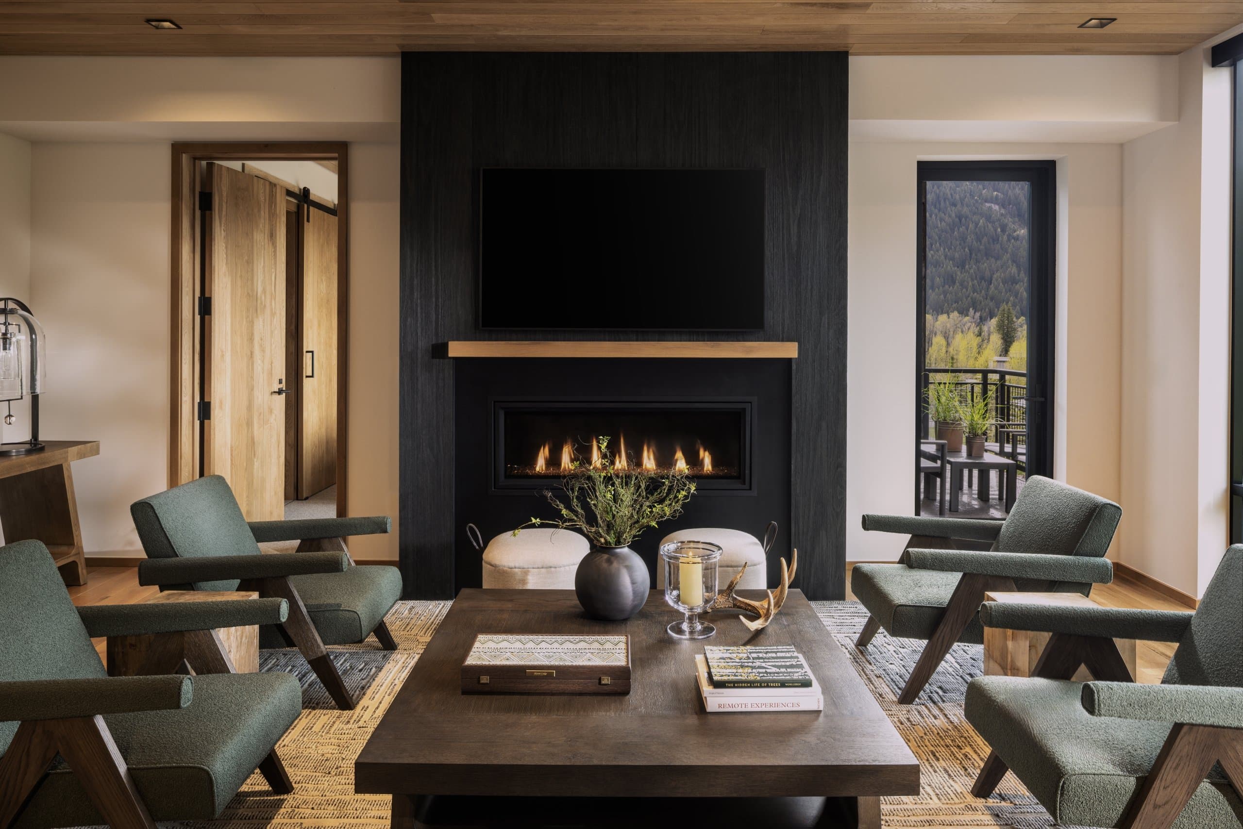 The living room with gas fireplace in a Sylvan Lodge suite.