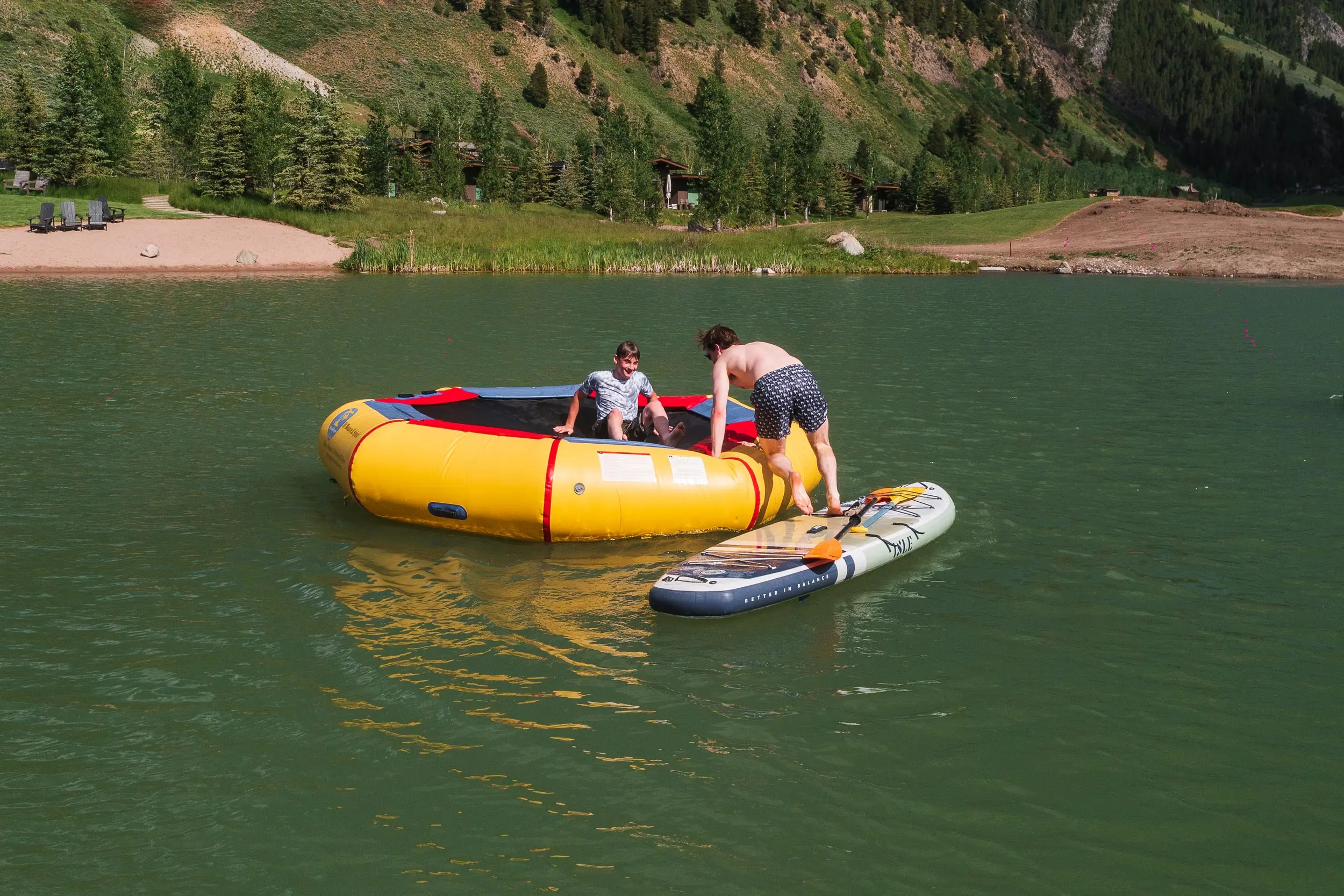 Paddleboarding And Trampoline In The Lake